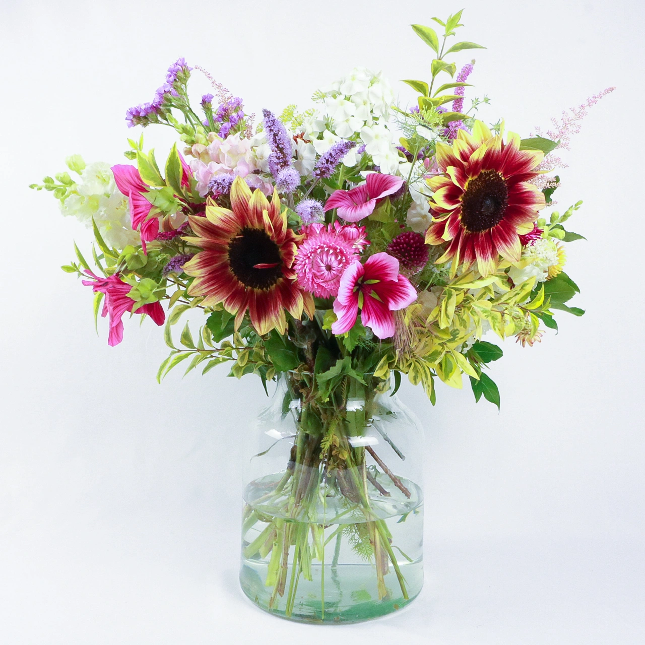 Marguerite Rose Devonshire Deluxe bouquet featuring fresh Devon-grown sunflowers, purple wildflowers, and pink cosmos, hand-arranged for delivery