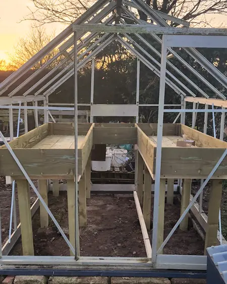 Construction of heated sandbeds inside the Marguerite Roses greenhouse in Devon for propagating cut flowers.